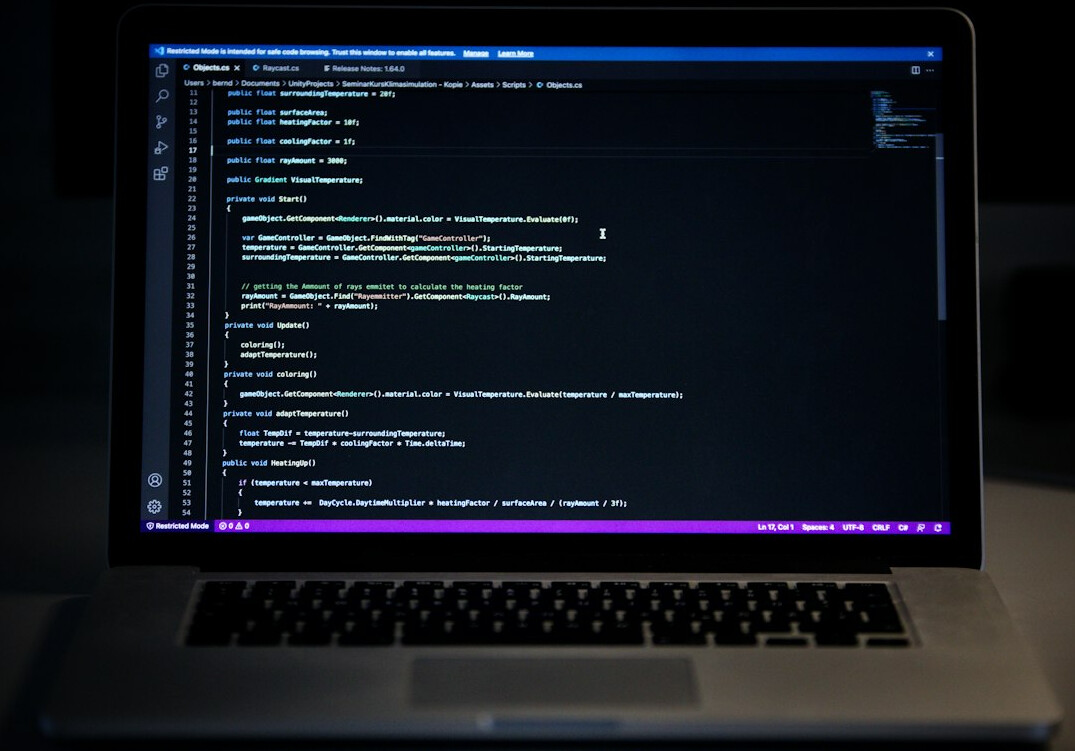 laptop with code on screen